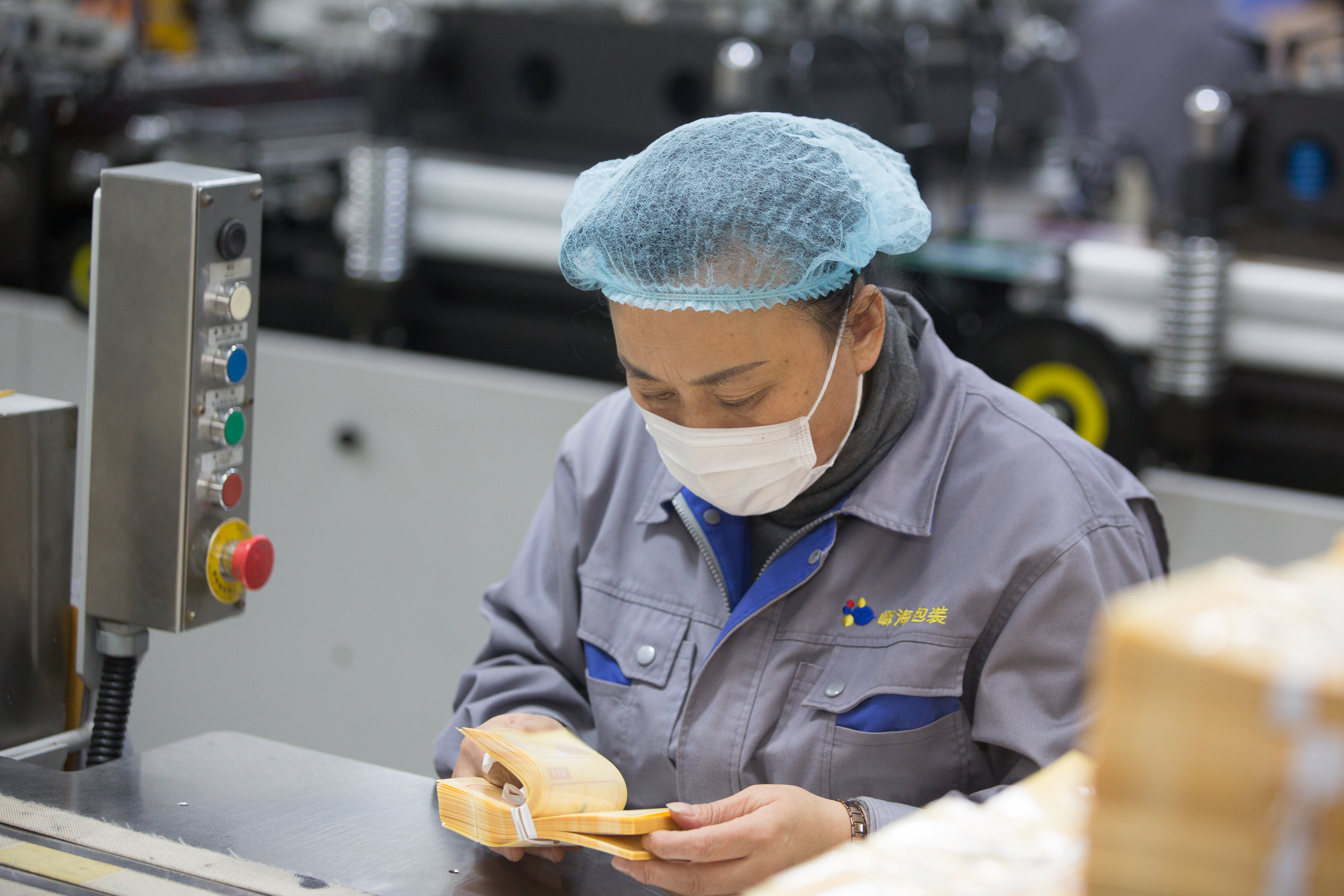 Expert reviewing packaging samples