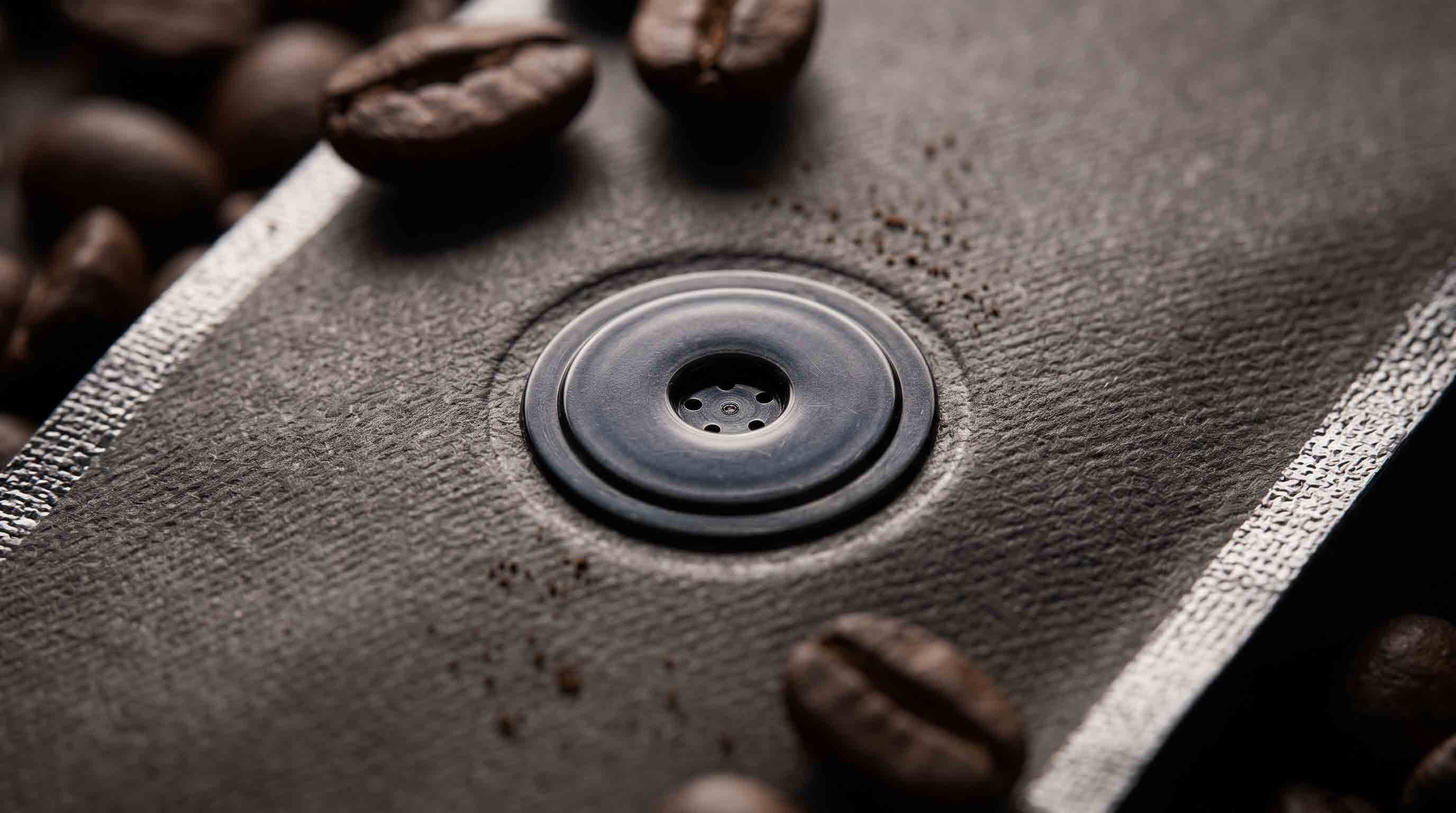 Macro shot of a one-way degassing valve on a premium custom coffee bag.