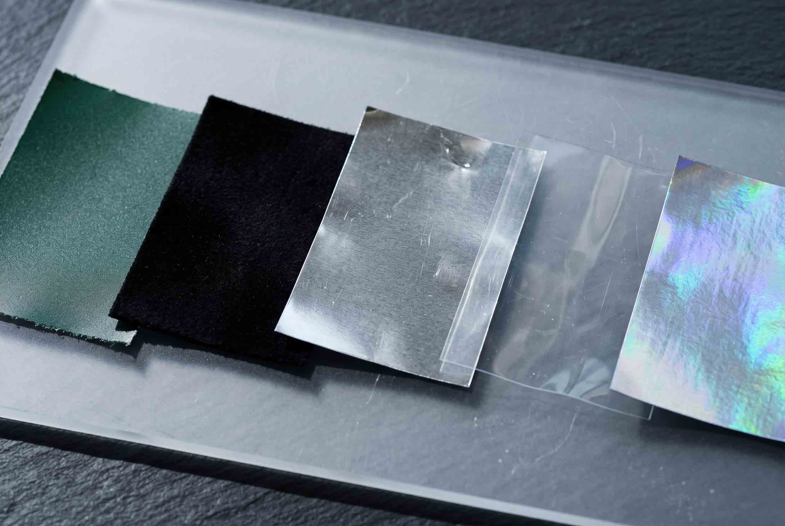 Flexible packaging material samples arranged for a sourcing review.