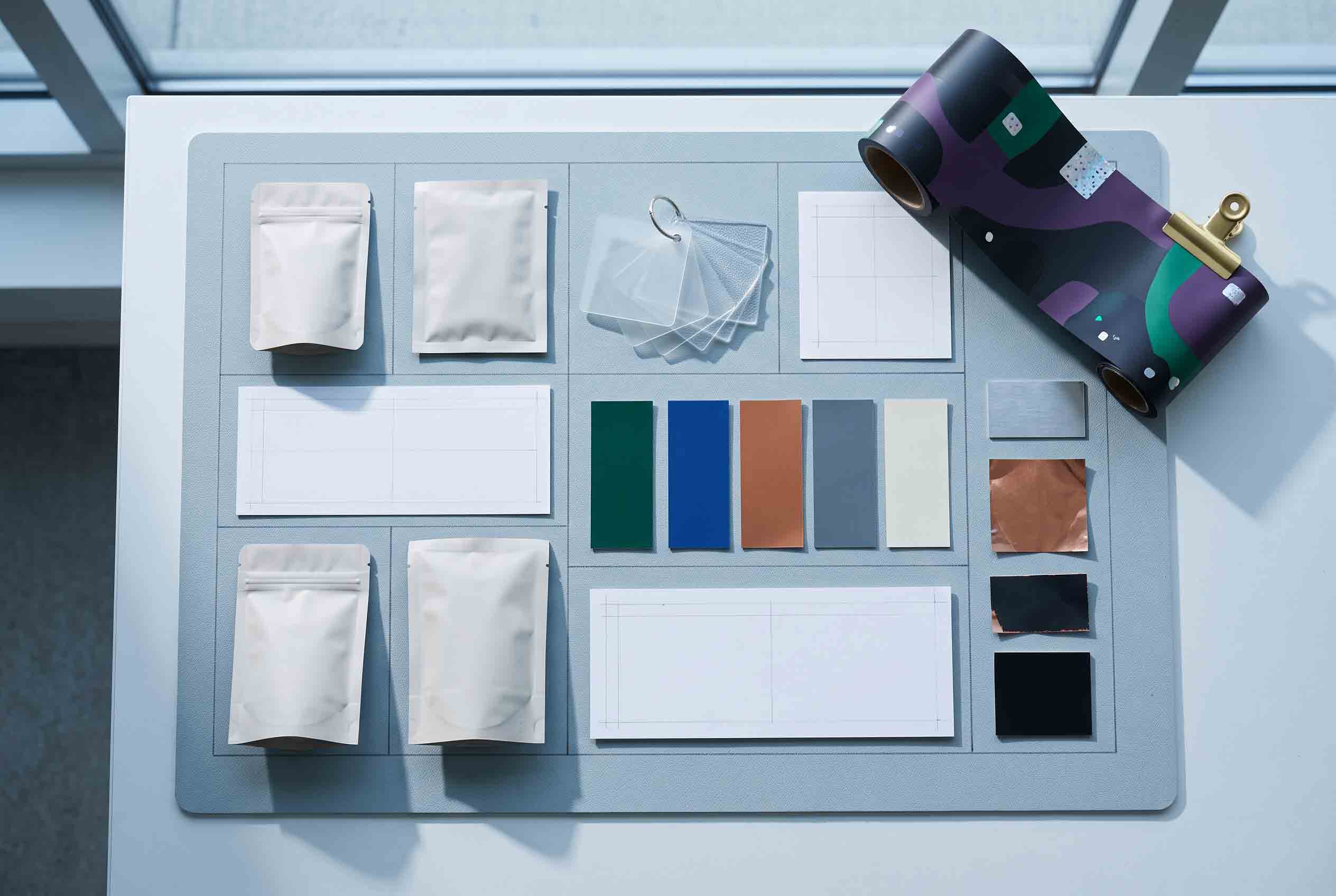 Packaging samples and material references prepared for a supplier inquiry.