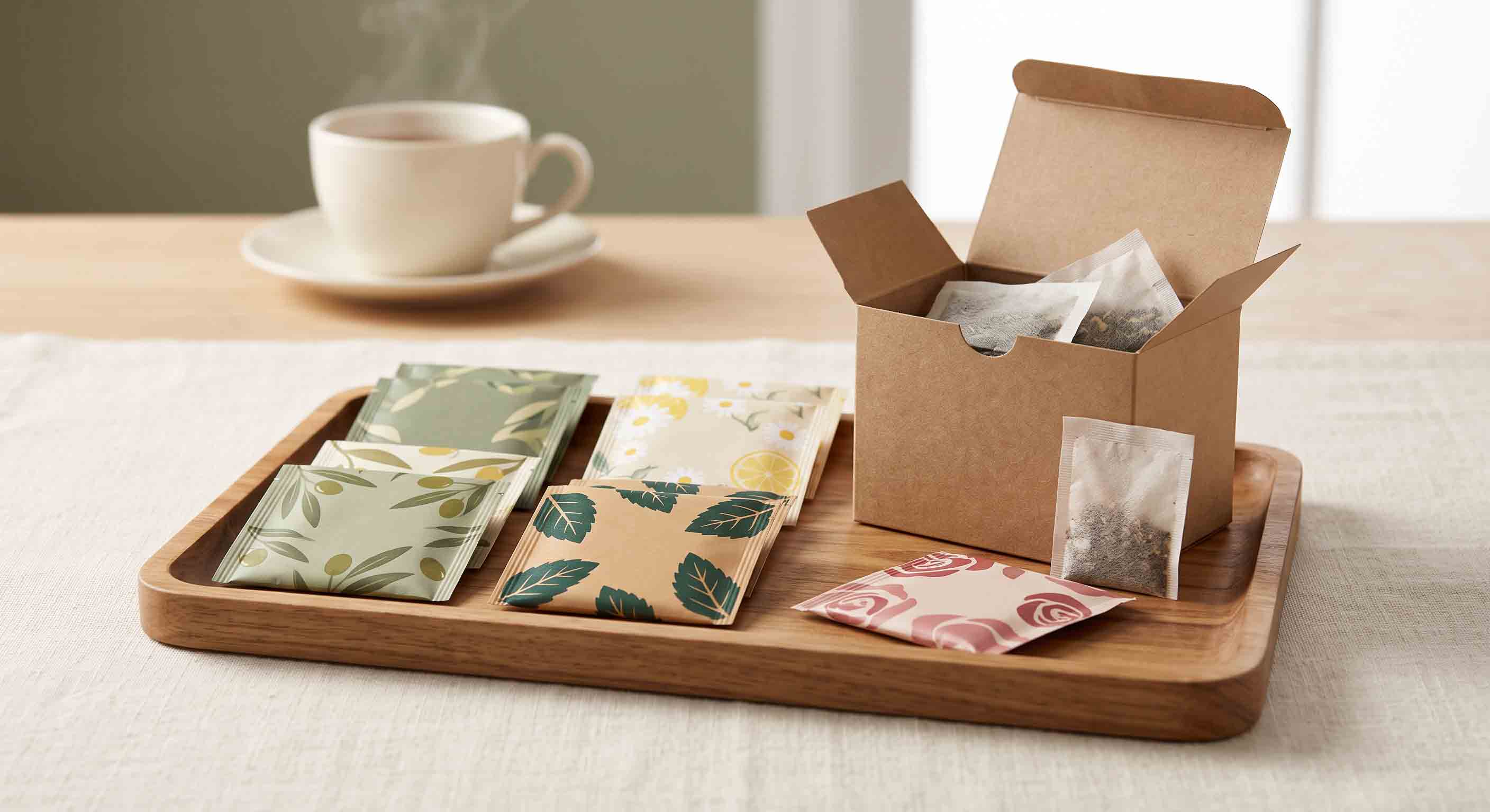 Illustrative order-planning reference of plain individual tea envelopes separated from a carton.